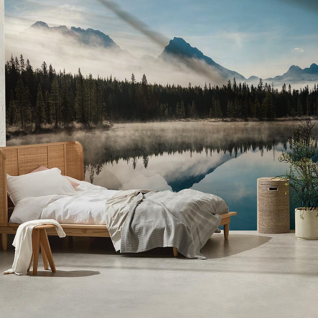 Tranquil Misty Mountain Lake wallpaper in serene blues and greens, serene bedroom, wooden bed, grey floor.