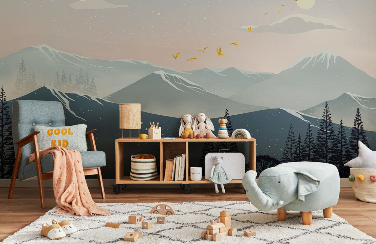 Children's room with mountain mural wallpaper, blue armchair, wooden flooring, soft toys, and plush elephant.
