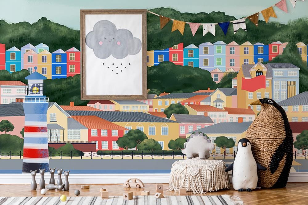 Scenic Coastal Town Mural Wallpaper features playful decor and toys, perfect for children's room styling.