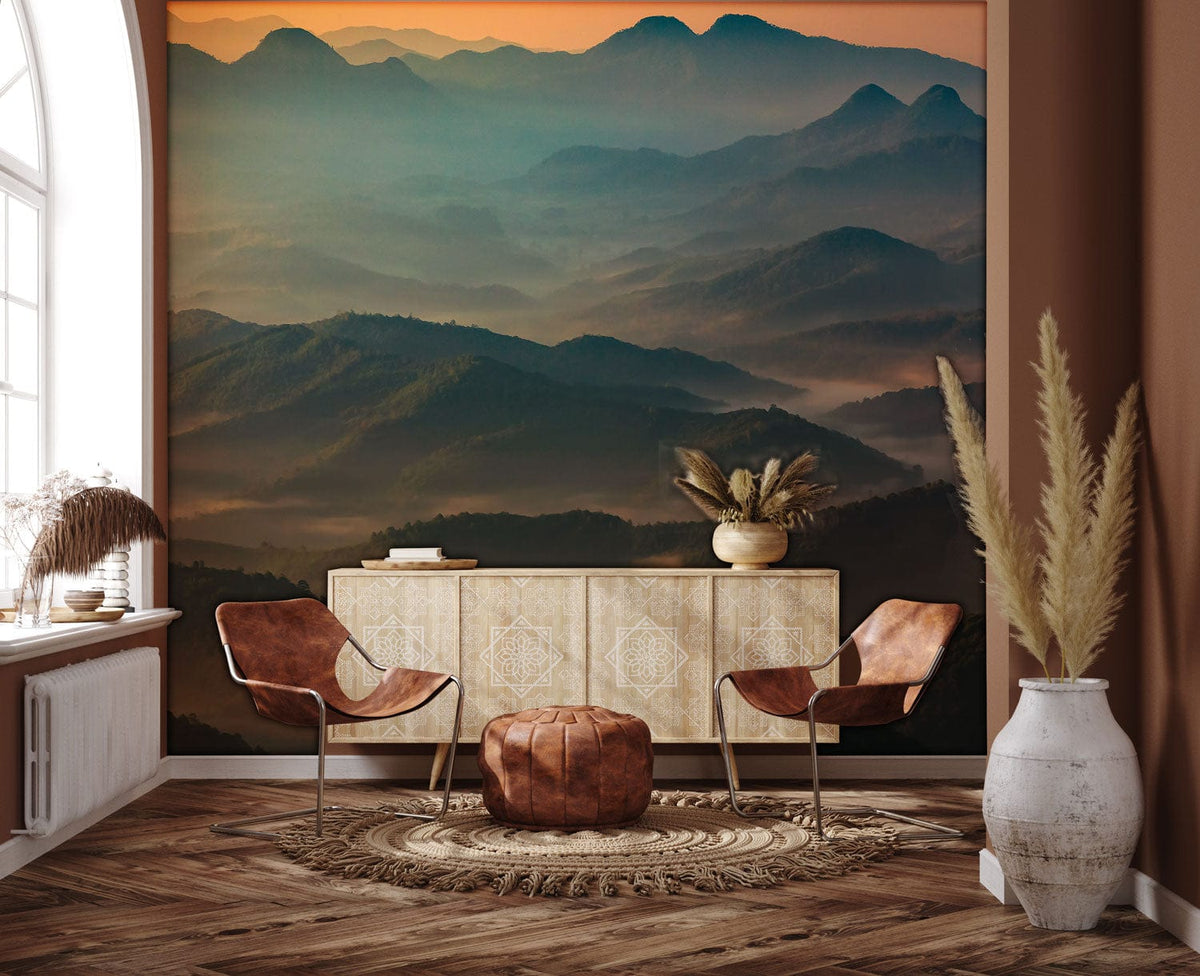 Serene Misty Mountain Mural Wallpaper, brown leather chairs, rustic wood floor, bohemian living room decor.