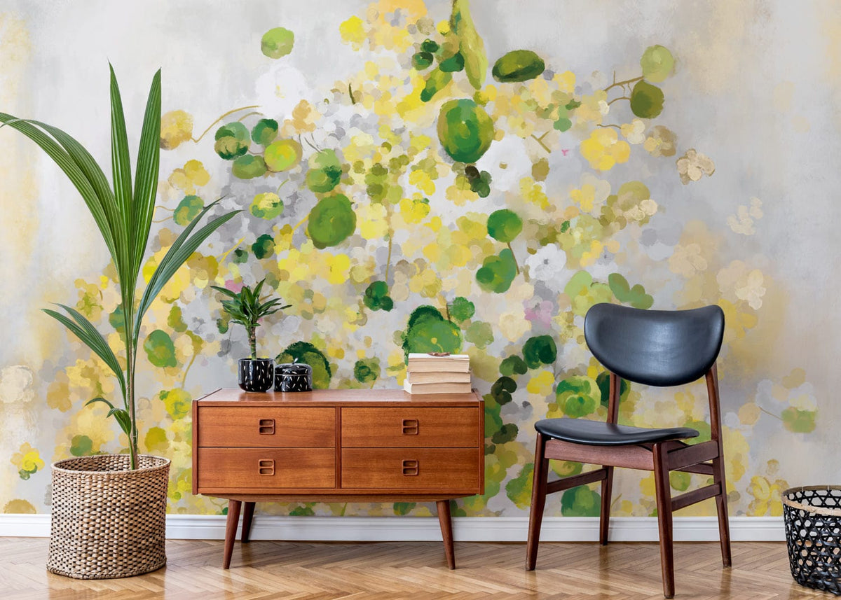 Bright abstract floral wallpaper in room with wooden cabinet, black chair, parquet flooring, tall plant.