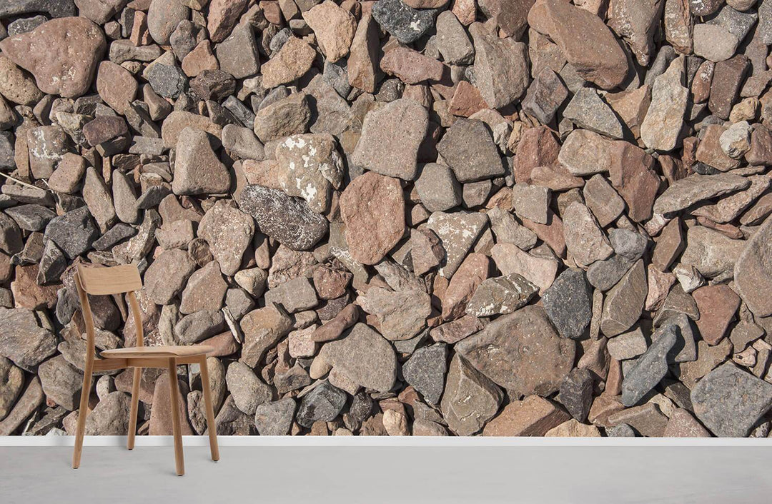 Rustic brown pebble-effect wallpaper, natural stone texture, with wooden chair, grey flooring, minimalistic room.