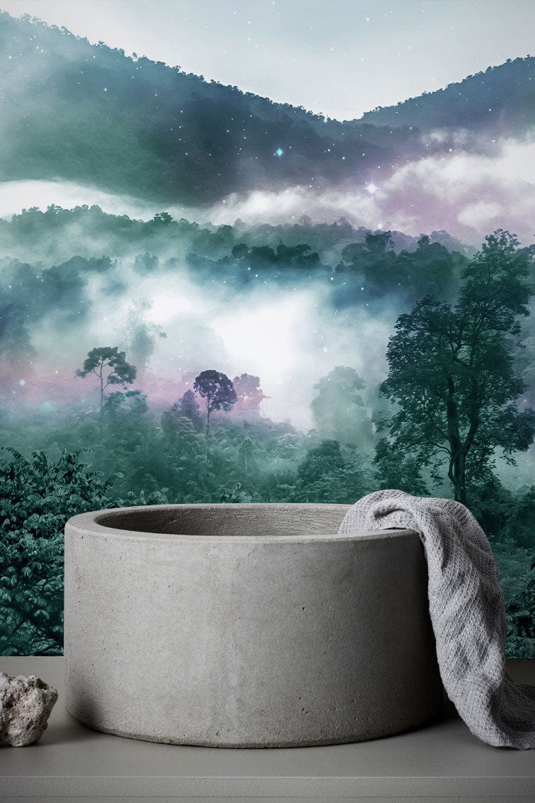 Mystical Forest Mist mural in green hues with bathroom setting featuring stone basin and textured towel.