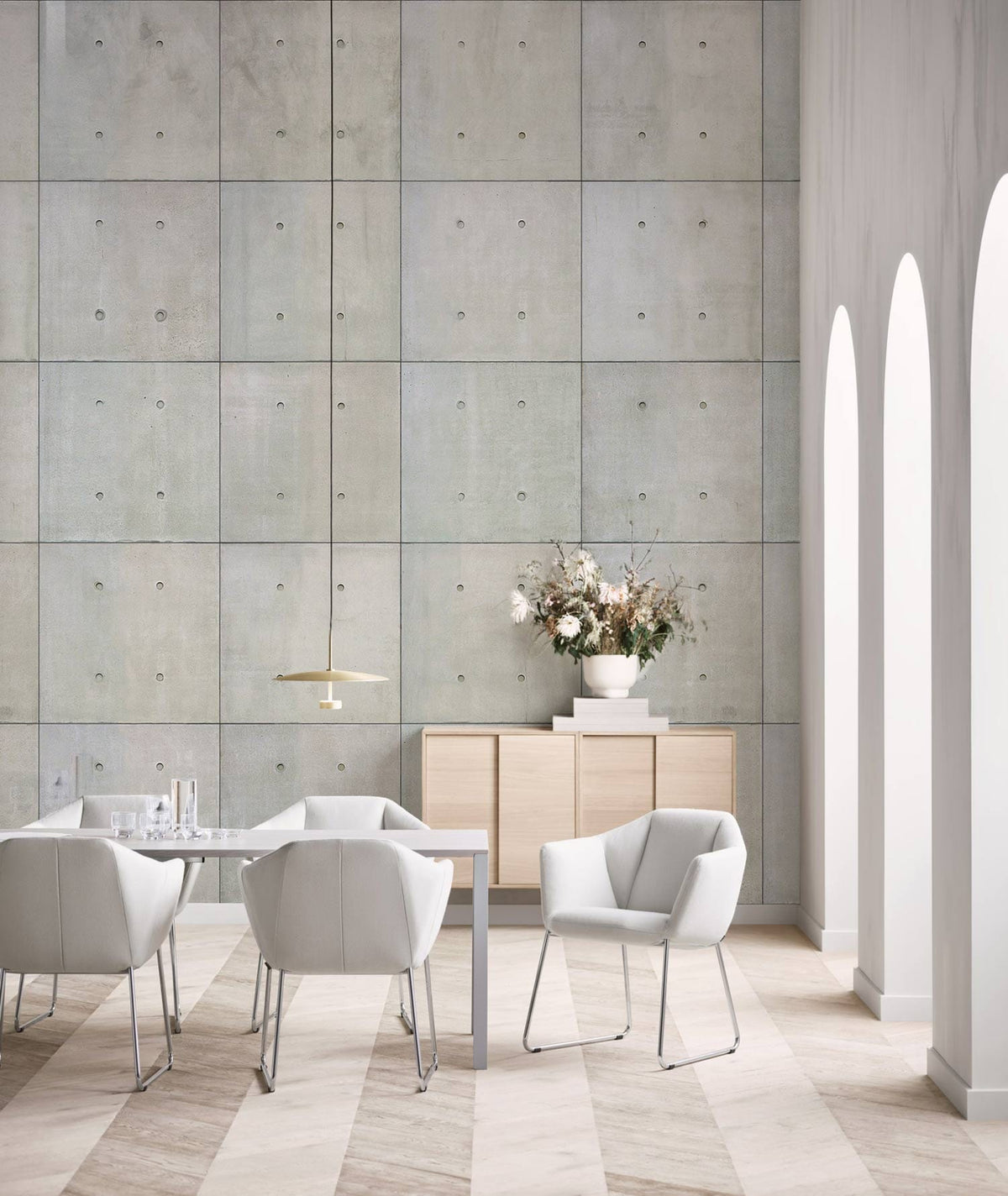 Modern Industrial Grey Concrete Wallpaper in dining room with white chairs and light wood flooring.