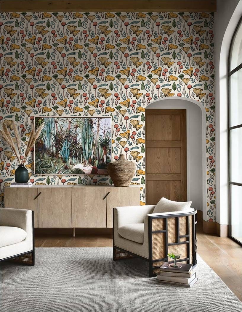 Vintage botanical herbs garden wallpaper in living room with wooden cabinet, cream armchairs, grey rug.