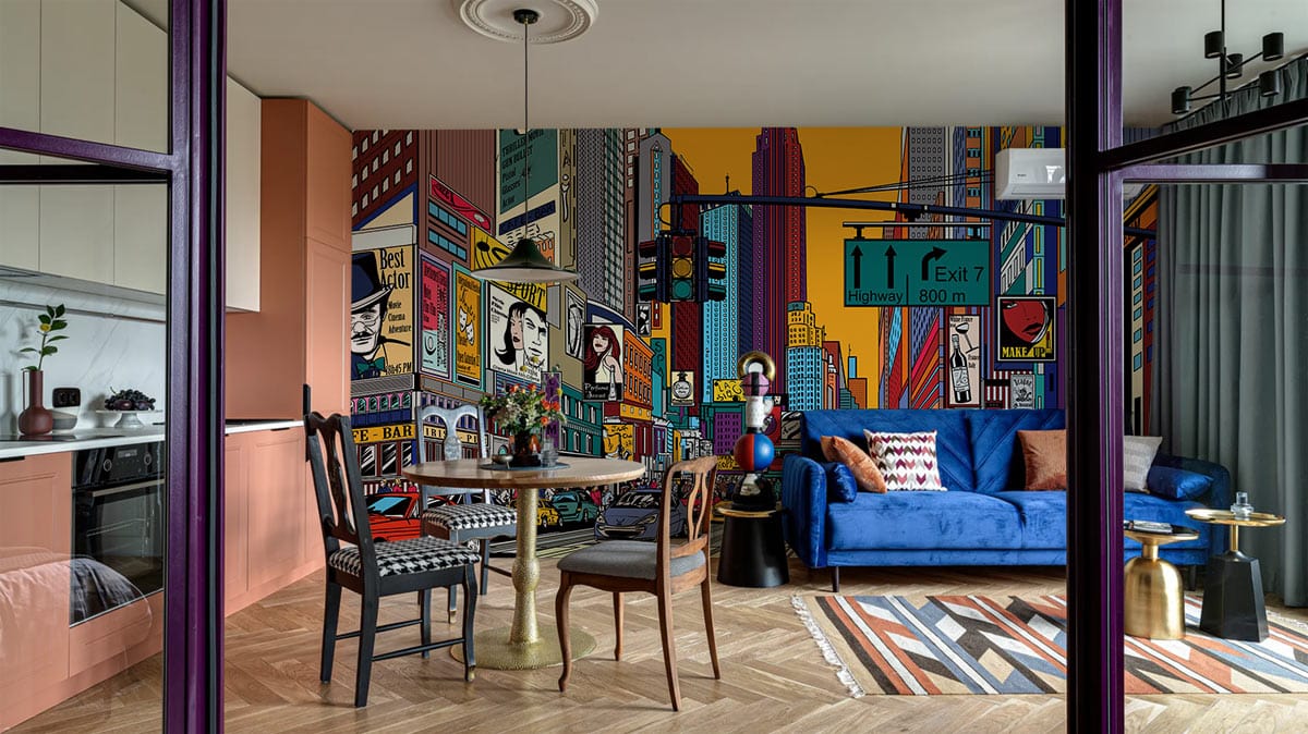 Colourful urban cityscape mural wallpaper, vibrant multicolours, blue velvet sofa, wooden flooring, cosy lounge.
