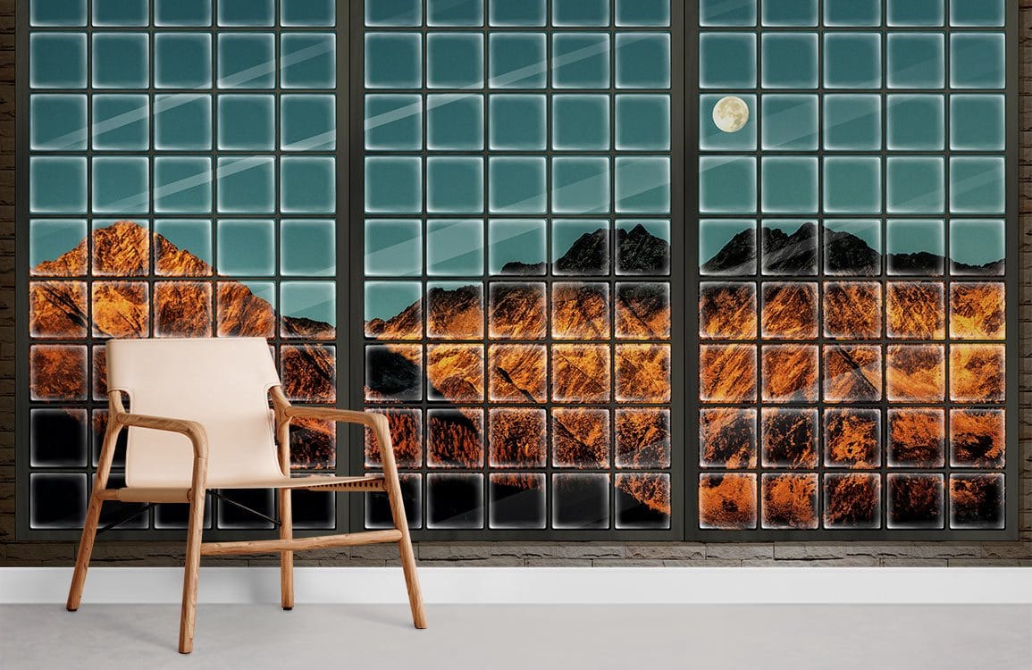 Sunlit Mountain Landscape Mural Wallpaper in blue room with wooden chair, glass block wall, light flooring.