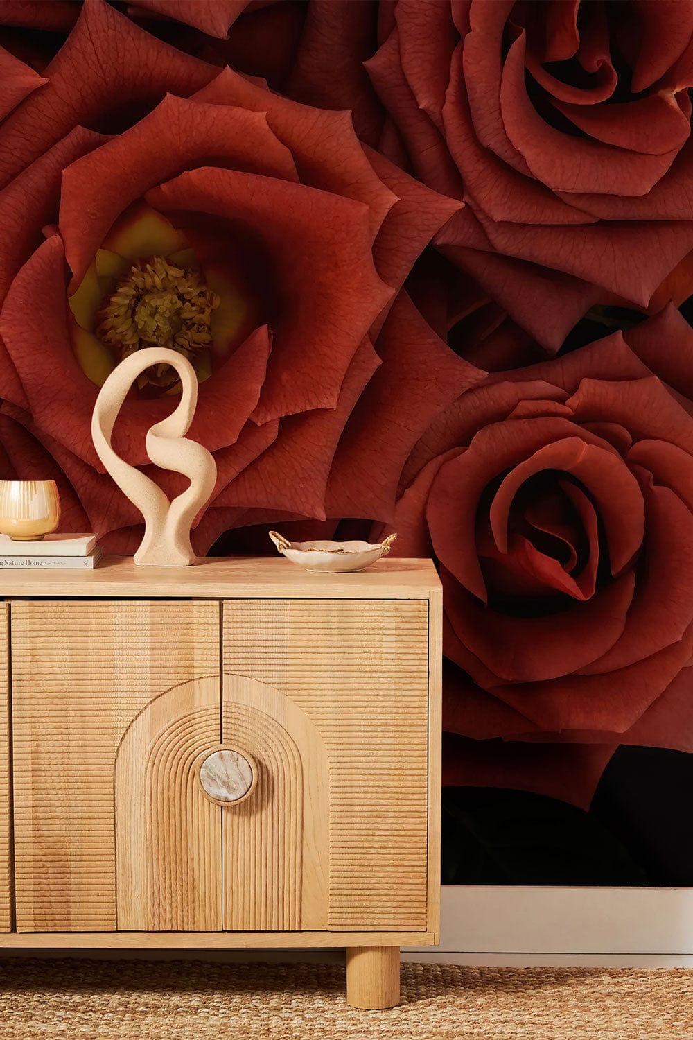 Luxurious deep red rose wallpaper, elegant wood cabinet, woven flooring, cosy interior design.