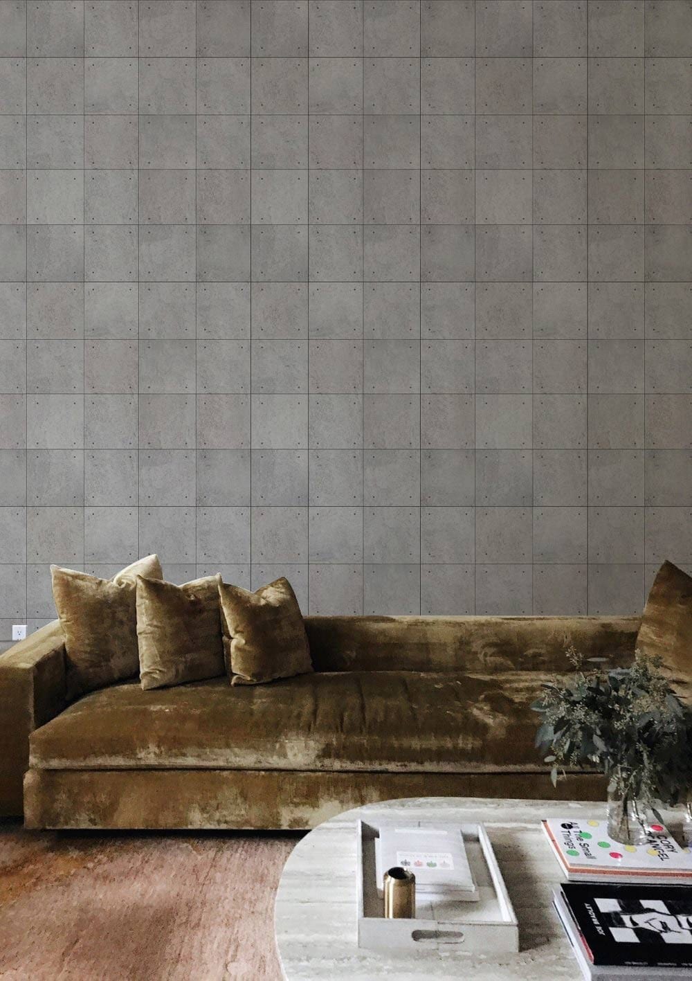 Contemporary grey stone tile effect wallpaper in modern living room with brown velvet sofa and rug.