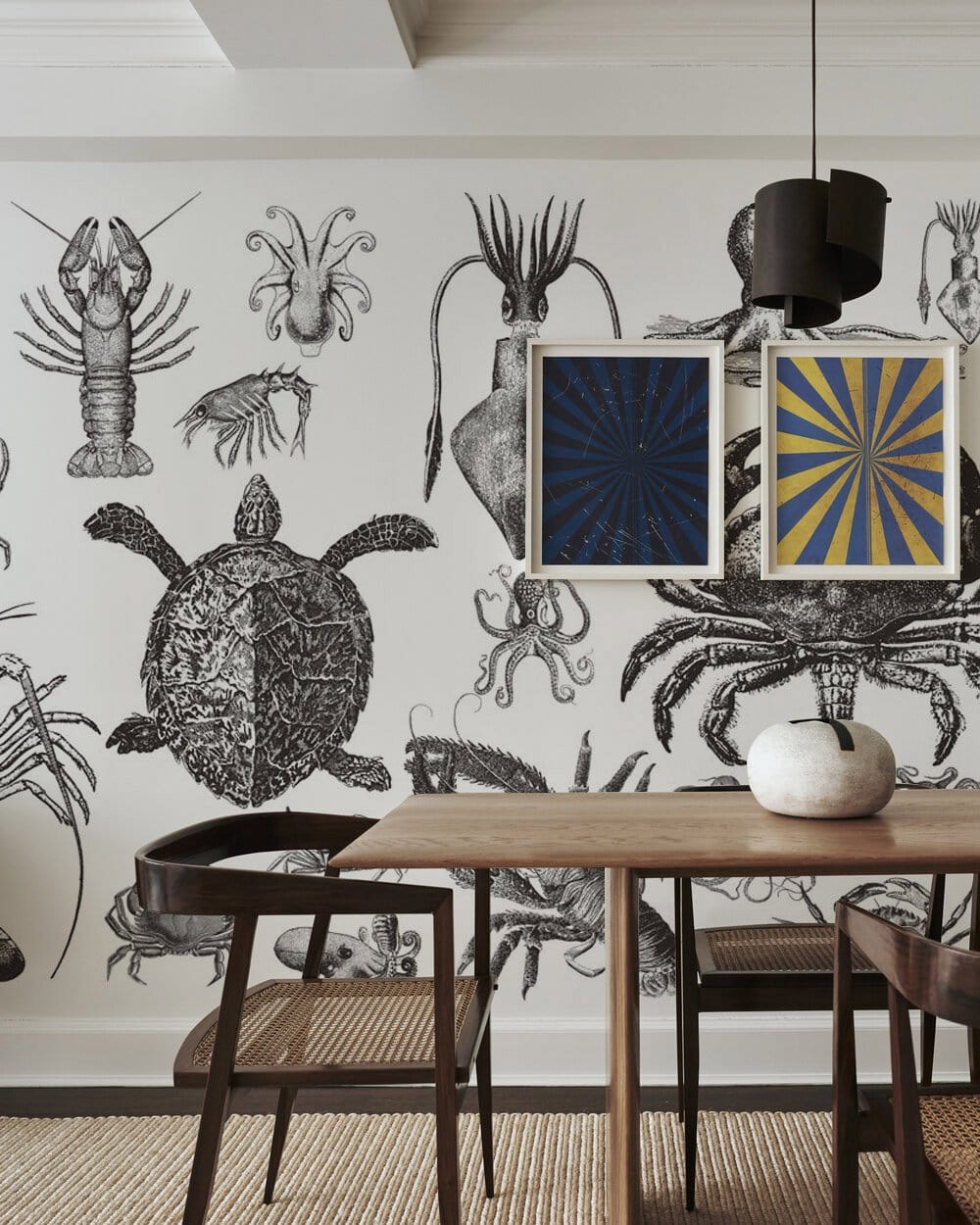 Vintage Marine Life Illustration Wallpaper in dining room with wooden chairs and table, monochrome ocean decor.