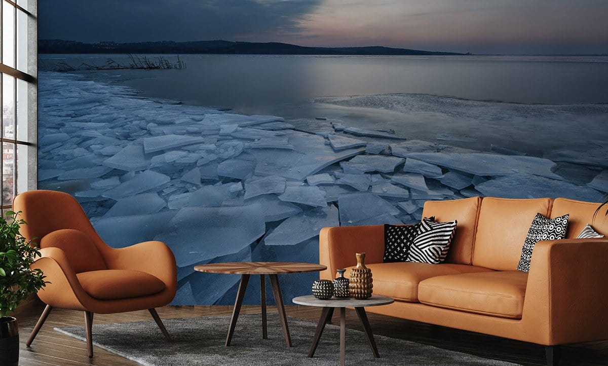 Elegant Frozen Lake Blue Mural Wallpaper in living room with brown sofa, modern chairs, wooden flooring.