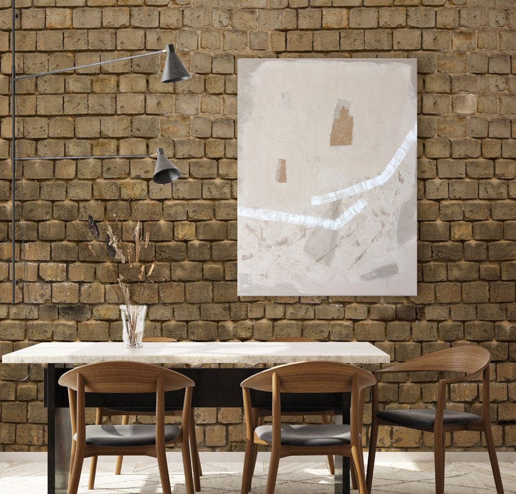 Rustic stone wall effect wallpaper, earthy brown in dining area; modern chairs, abstract painting, light fixture.