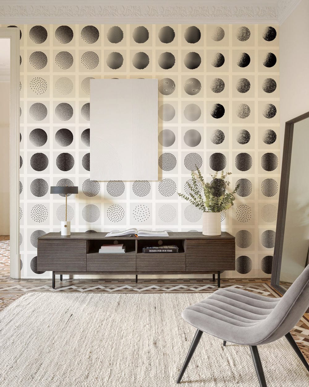 Monochrome geometric circles wallpaper mural in modern living room with textured flooring and sleek decor.