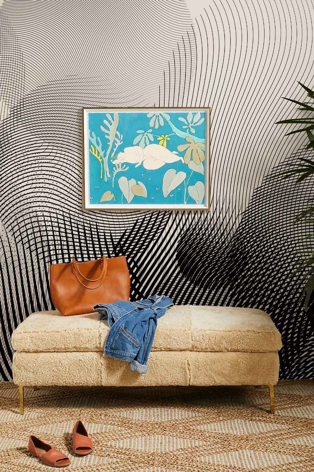 Hypnotic curved line wallpaper with beige bench, blue artwork, and patterned carpet in modern living area.