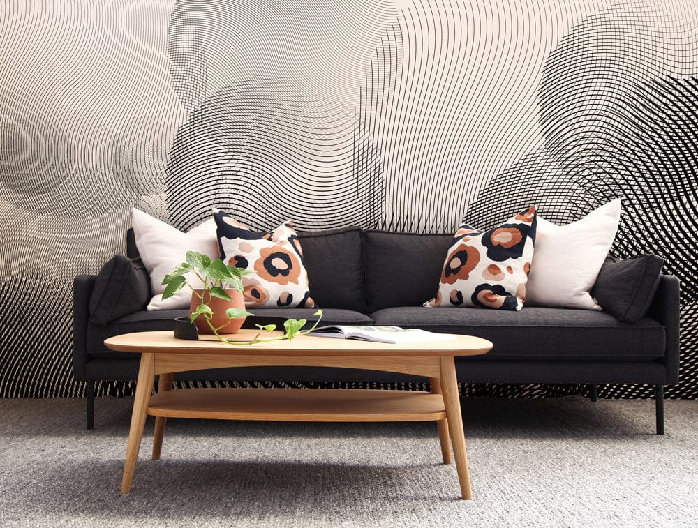 Black and white curved line wallpaper, modern sofa, wooden coffee table, grey carpet in living room.