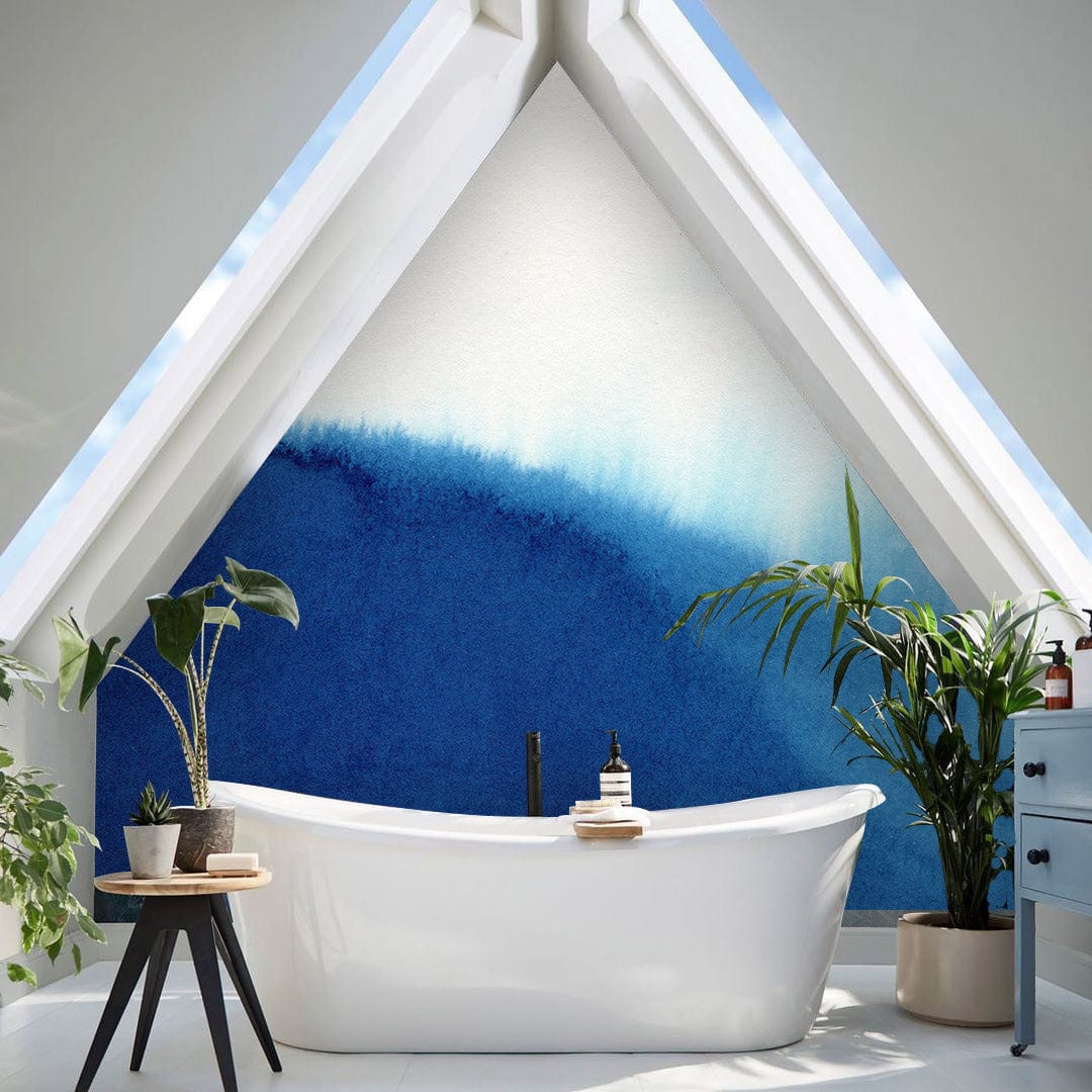 Elegant Blue Watercolour Abstract Mural Wallpaper in modern loft bathroom with freestanding bathtub, skylights.