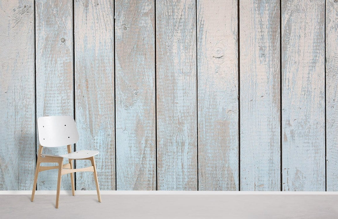 Rustic light blue wooden plank effect wallpaper with vintage decor, featuring minimalist white chair.