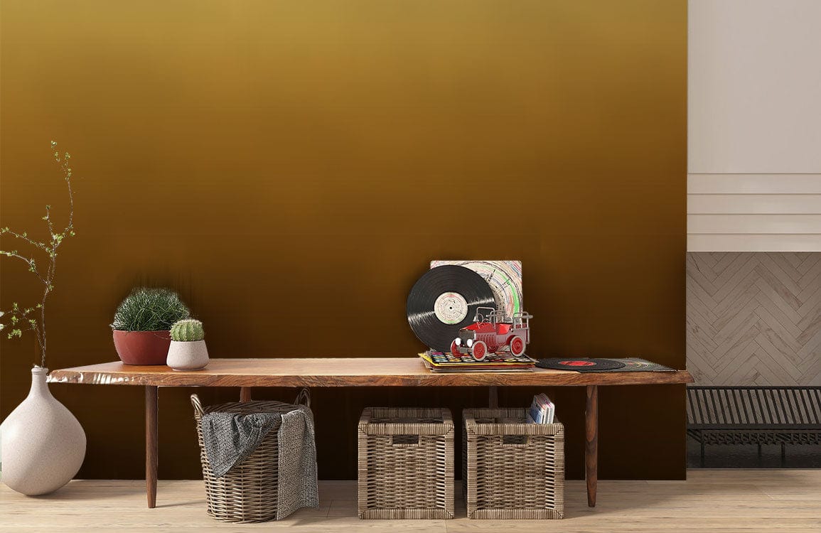Elegant Golden Ombre Gradient Wallpaper in living room with wooden bench, wicker baskets, and fireplace.