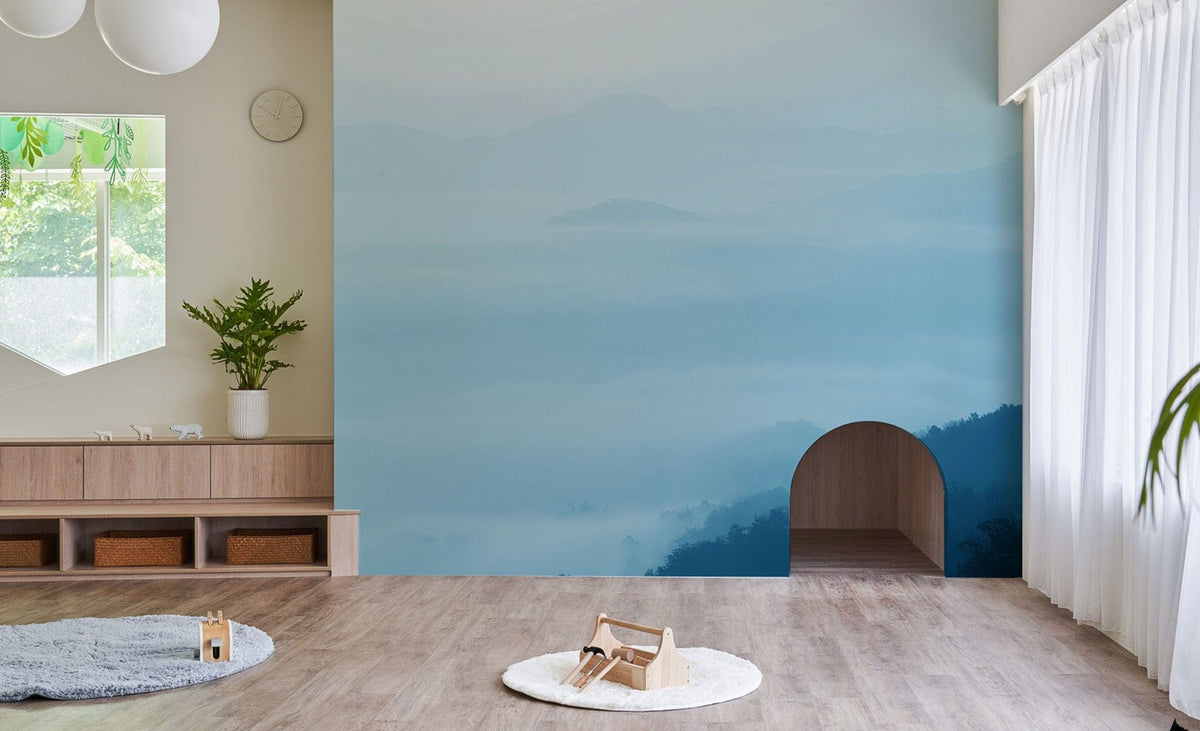 Tranquil Blue Mist Mountain Landscape Mural Wallpaper in serene room with light wood flooring.