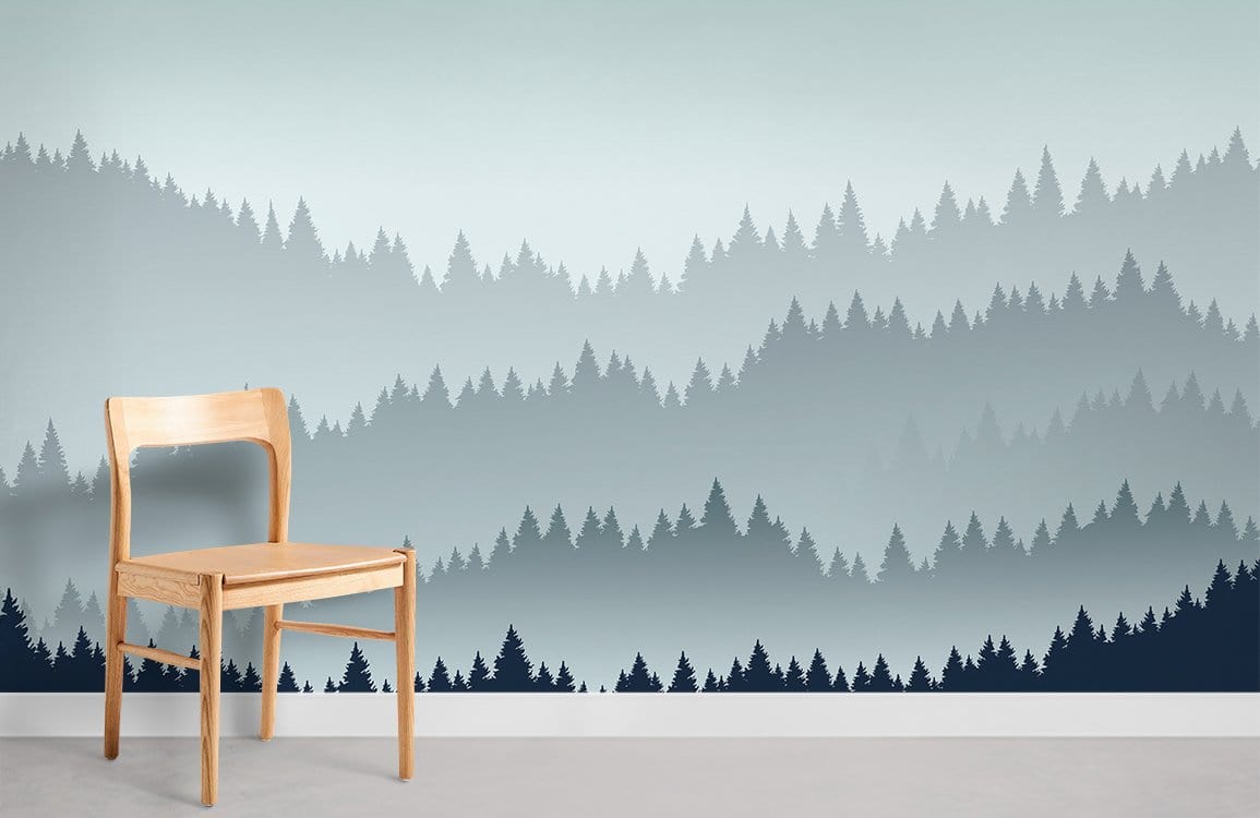 Misty Blue Forest Landscape Mural Wallpaper in room with wooden chair and light grey flooring.