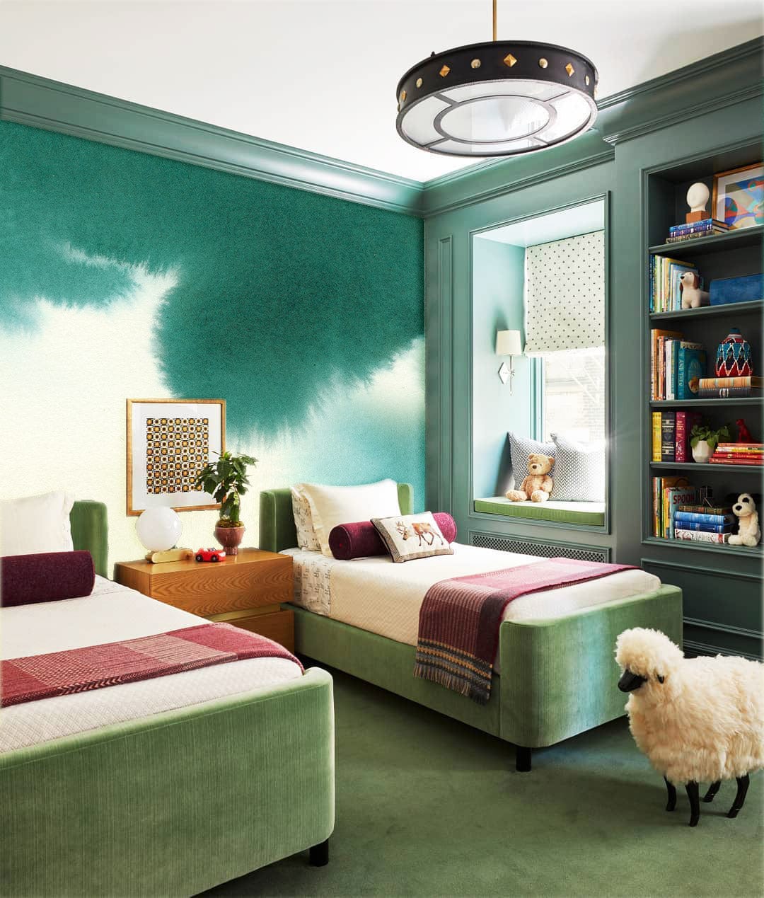 Modern bedroom with Emerald Watercolour Art Mural Wallpaper, green velvet beds, and unique hanging light fixture.