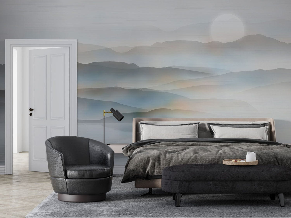 Tranquil Misty Mountain mural in bedroom with grey armchair, cushioned bed, grey rug, and elegant decor.