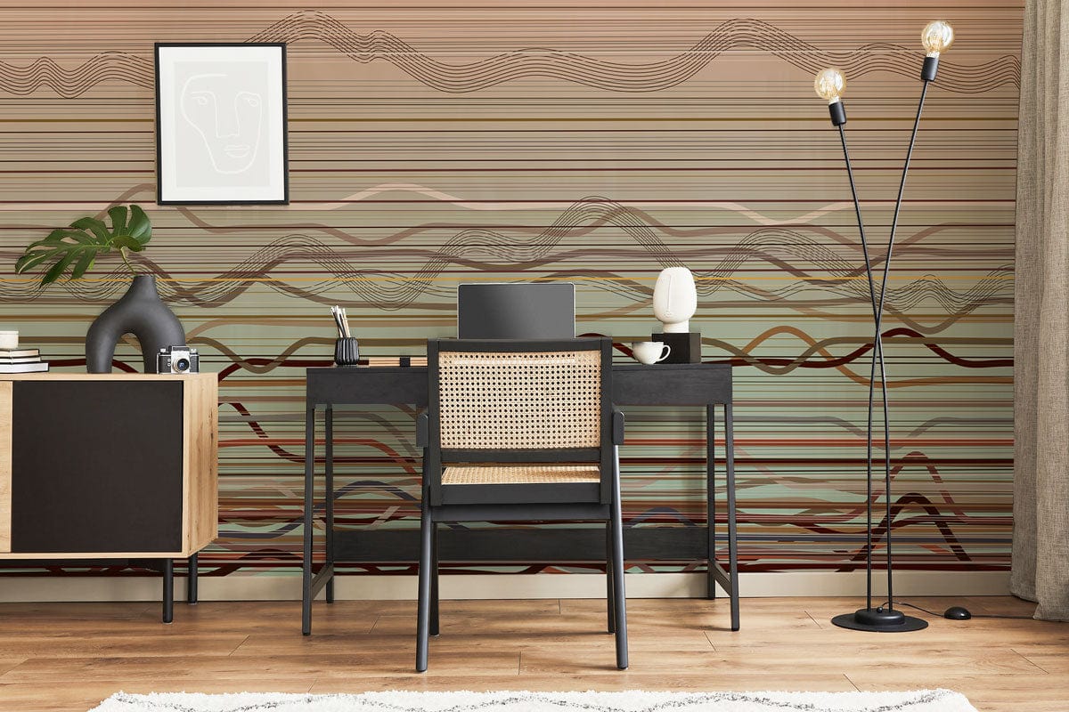 Earthy toned abstract wallpaper in modern office, with black desk, cane chair, and wooden flooring.