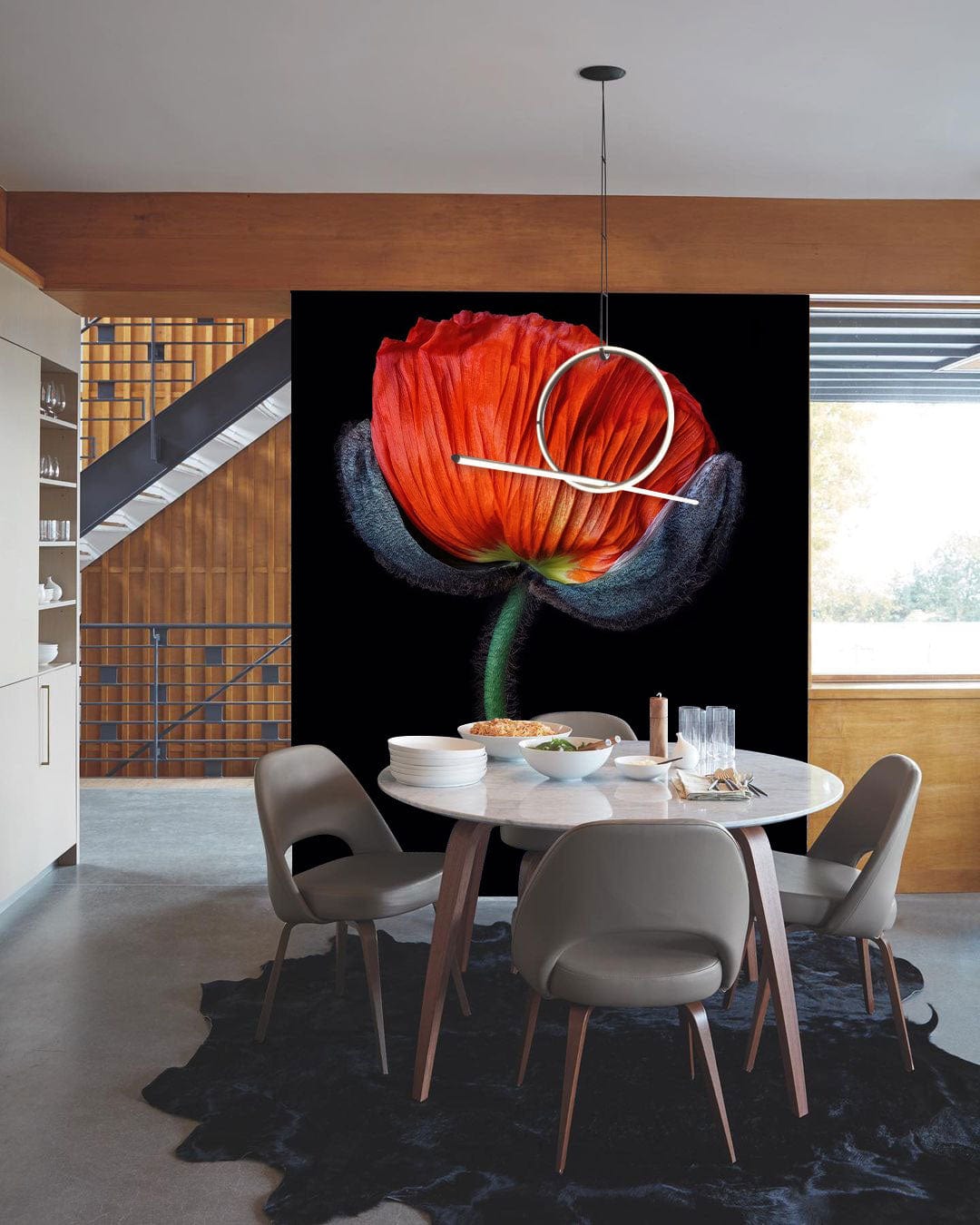 Elegant red poppy floral wall mural in modern dining room with round table and grey chairs.