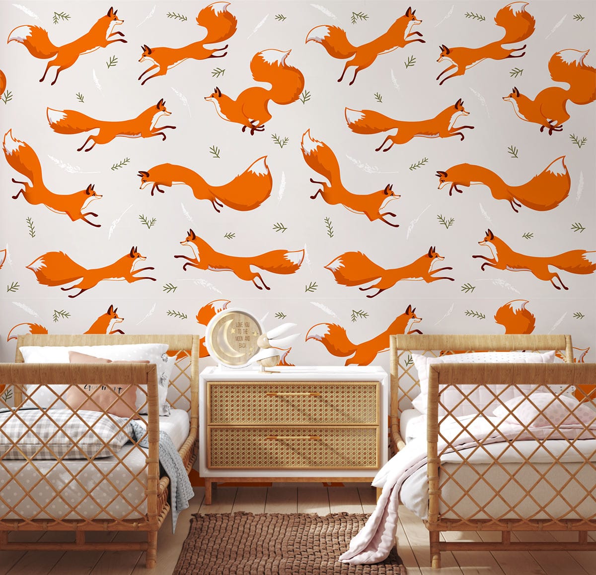 Playful Fox Wallpaper in orange with rattan furniture, wooden flooring, and cosy children's bedroom setting.