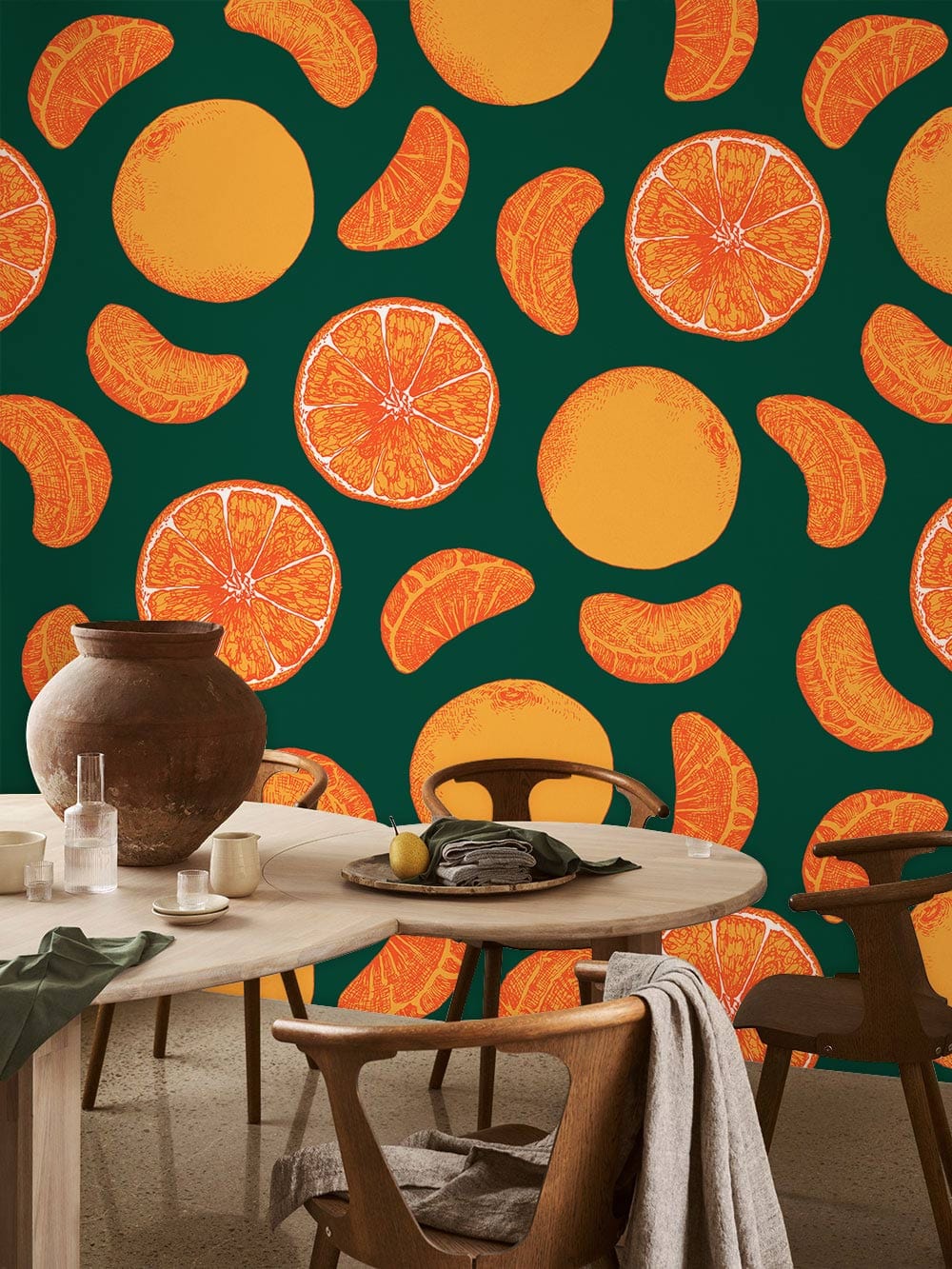 Vibrant citrus pattern wallpaper, round wooden dining table, brown chairs, modern interior design style.