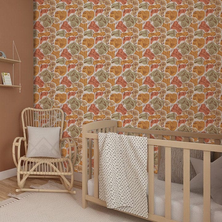 Rattan chair, wooden cot, autumnal leaf motif wallpaper in warm earthy tones, beige carpet, nursery room.