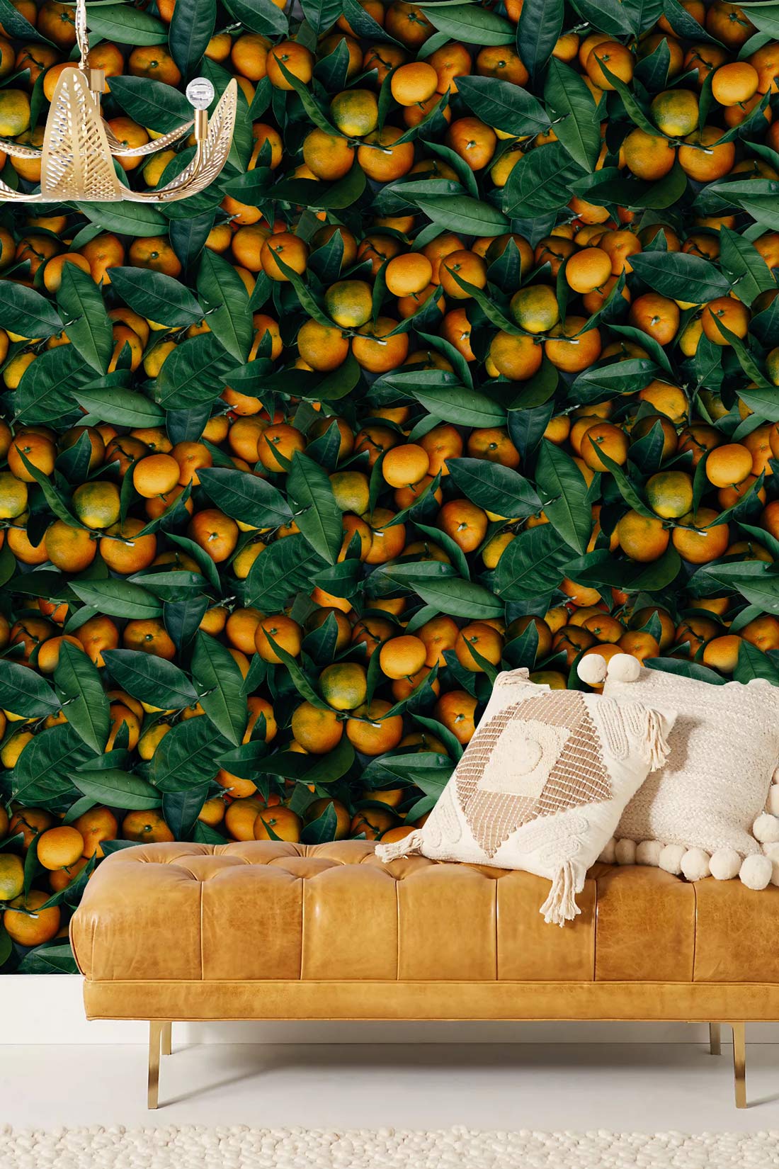 Vibrant Citrus Orchard Leaf Pattern Mural Wallpaper, tan leather sofa, neutral rug, stylish pendant light.