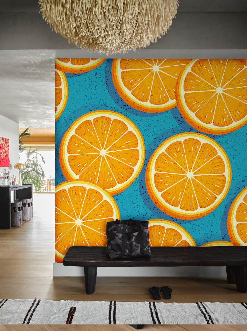Tropical Orange Slice Pattern Wallpaper with vibrant citrus design, wooden bench, modern rug, and lamp.