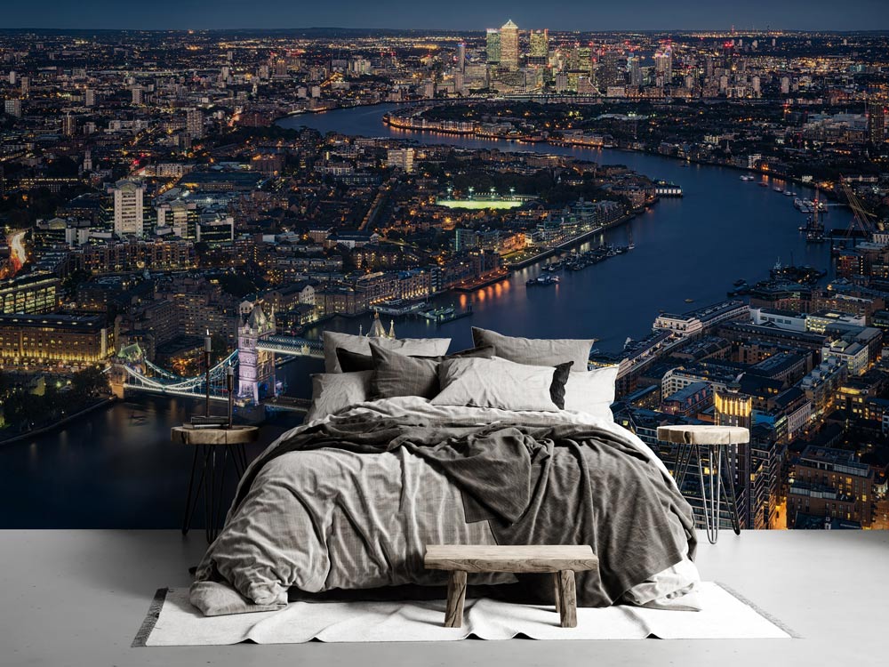 Stunning London Night Skyline Mural with Tower Bridge, grey bedding, wooden bench, modern bedroom setting.
