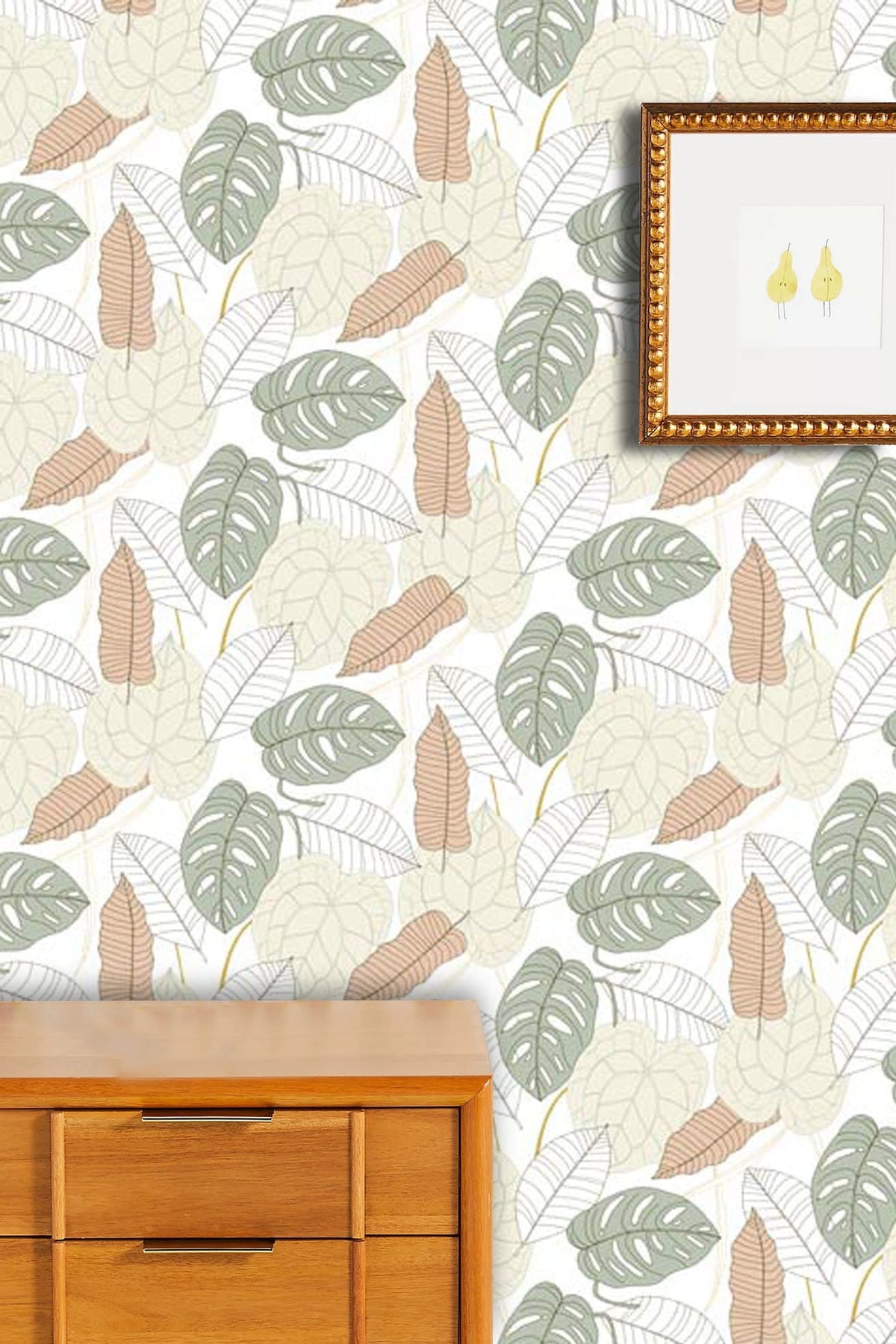 Botanical Green Beige Leaf Pattern Wallpaper in modern interior with wooden dresser and framed art.