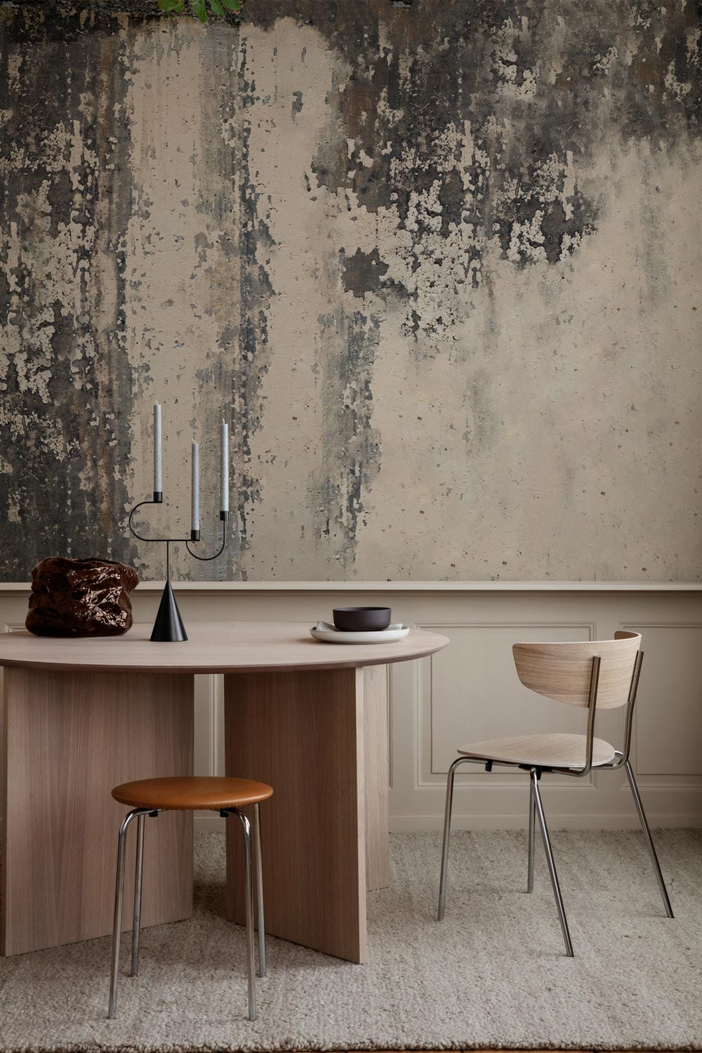 Vintage industrial grunge wall mural, rustic grey tones, wooden table, modern chairs, elegant dining room.