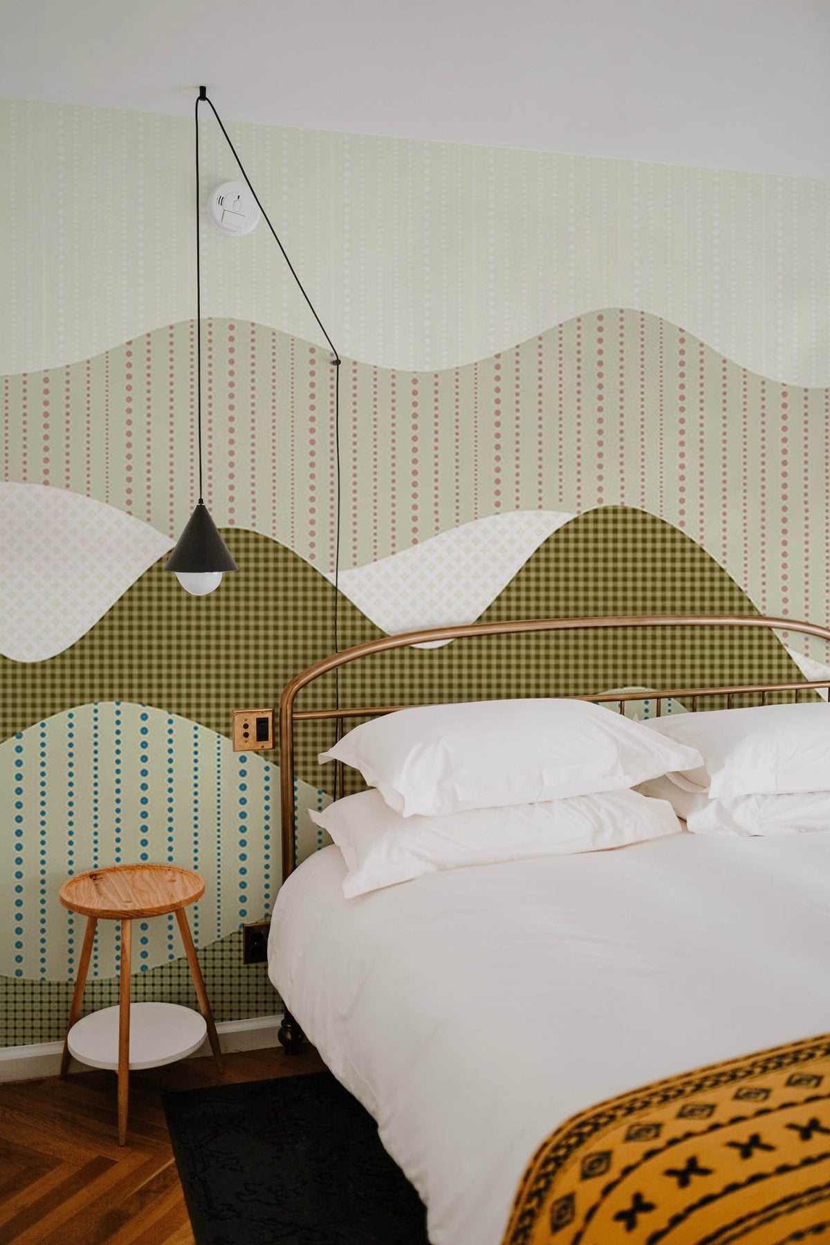 Abstract mountain landscape wallpaper, earthy tones, modern bedroom, white bed, parquet flooring, pendant light.