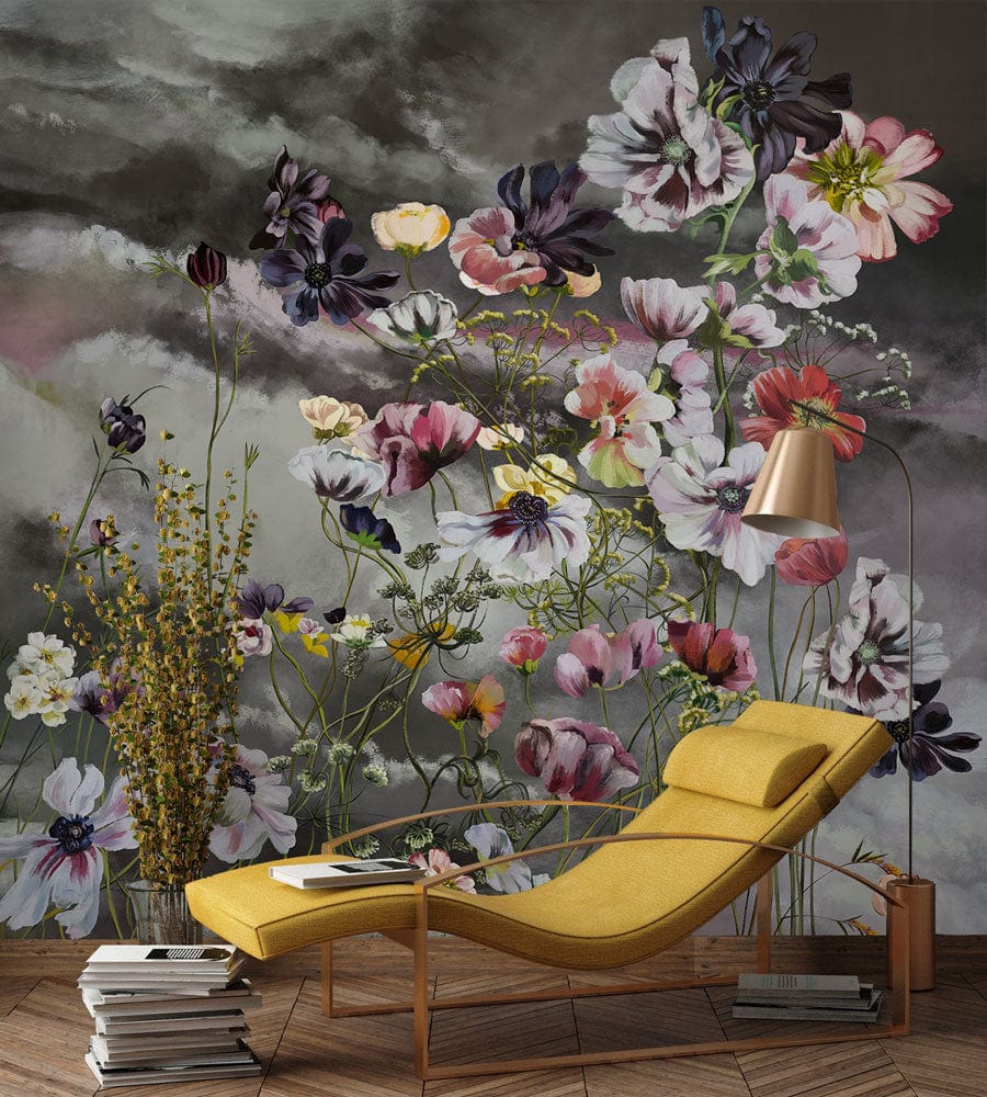 Floral Fantasy Mural Wallpaper with pastel blooms, yellow modern chaise, moody skies background, wooden flooring.