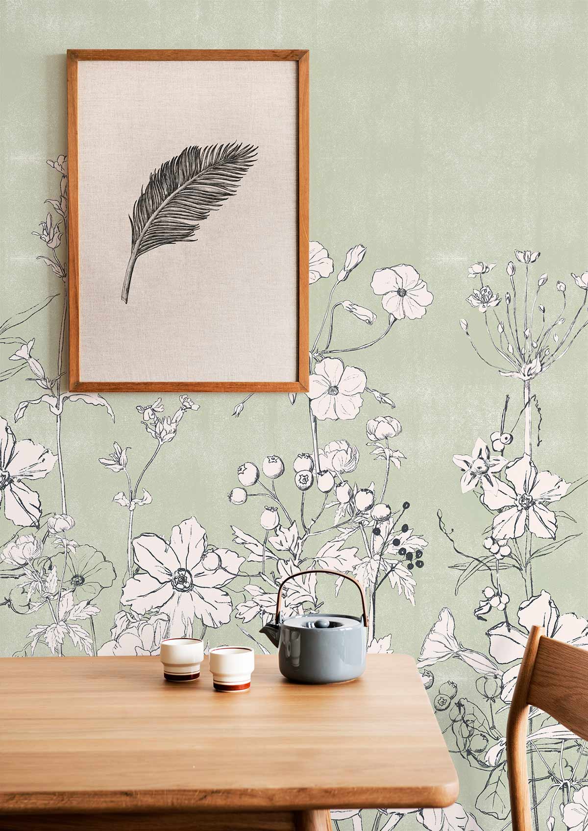 Elegant Sage Green Floral Mural Wallpaper by Brand, framed art, light wood table, peaceful atmosphere.