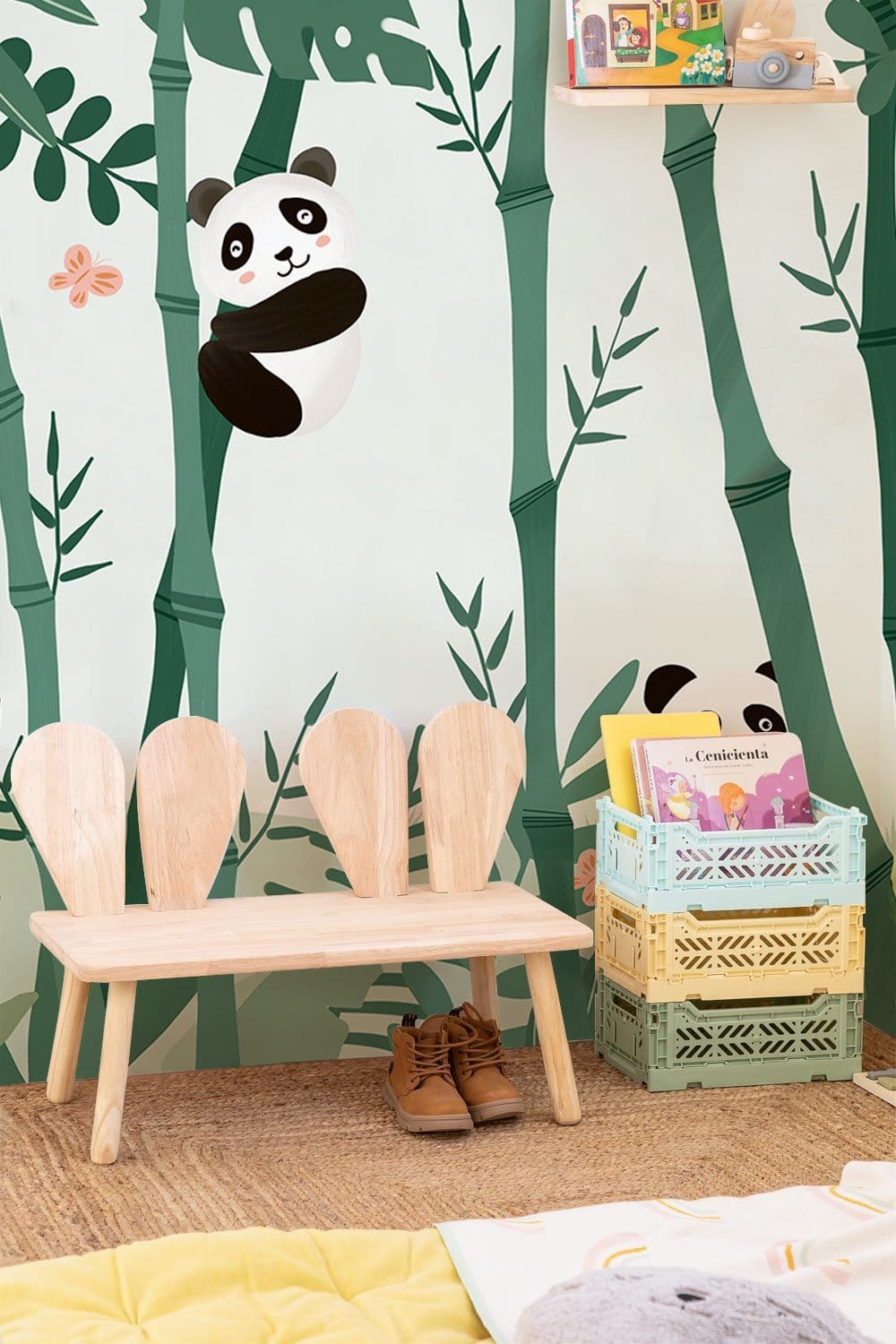 Playful Panda Bamboo Jungle Mural Wallpaper with wooden bench, colourful storage crates, playful nursery setting.