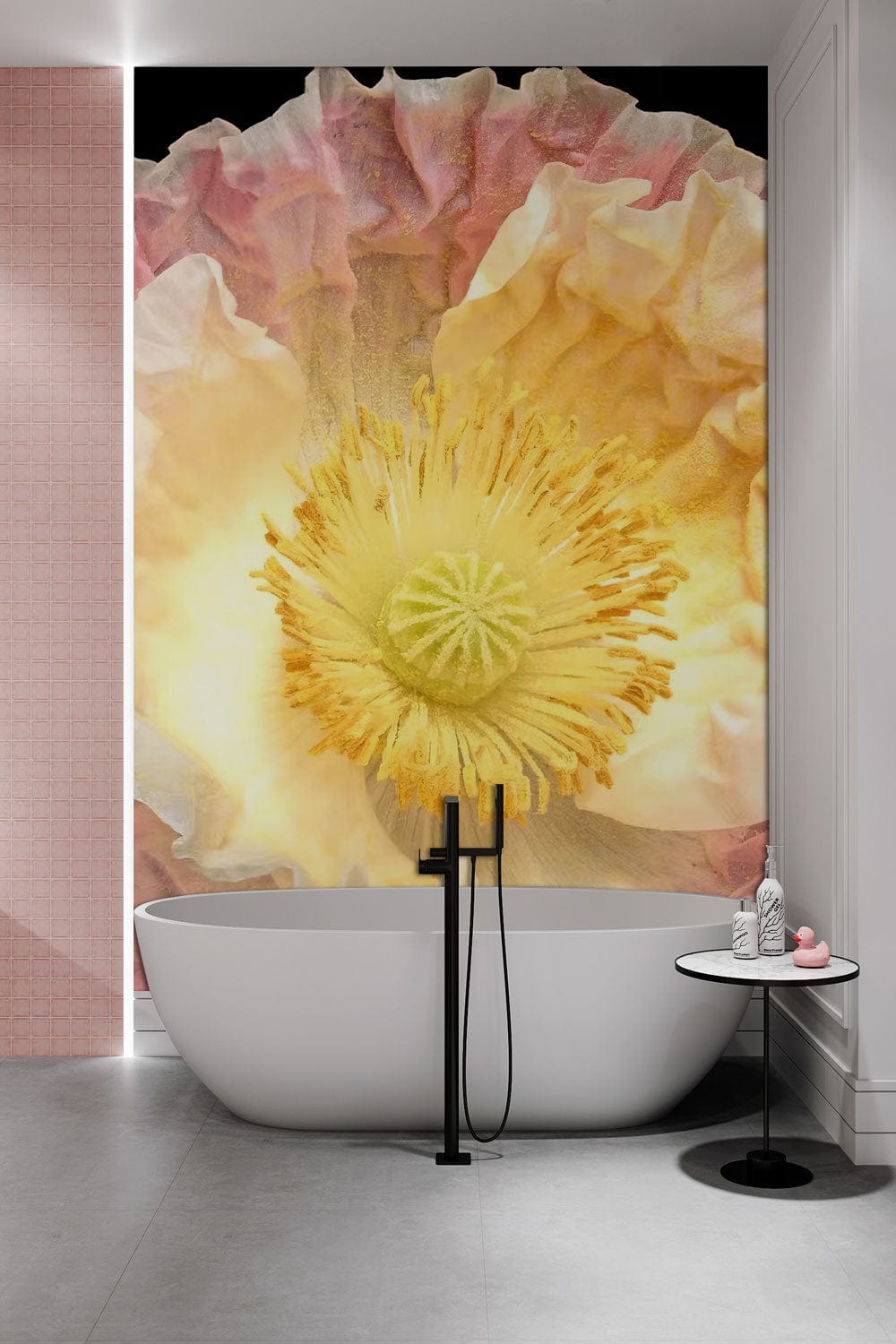 Luxurious bathroom with elegant pastel pink floral bloom mural wallpaper, white bathtub, and grey flooring.
