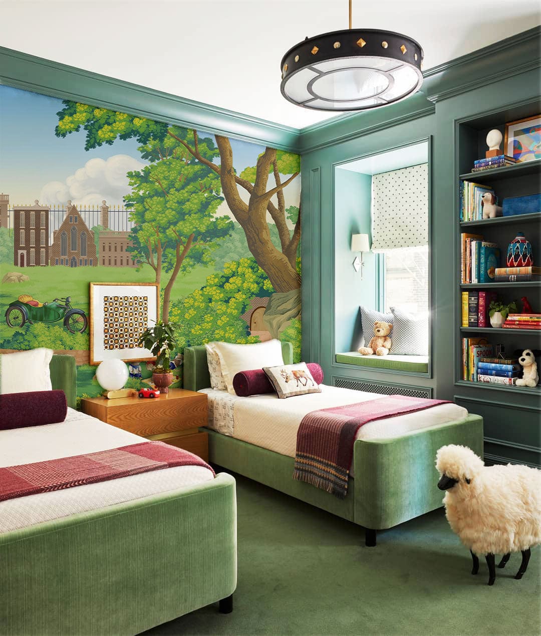 Children's room with green sofa beds, green carpet, playful wallpaper mural, countryside scene, vintage decor.
