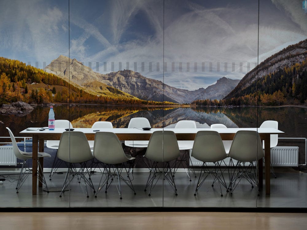 Panoramic Mountain Lake Mural in dining room with modern chairs, wooden table, and lake reflection wallpaper.