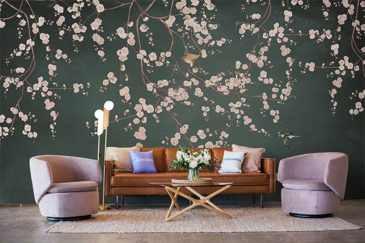 Elegant dark green floral wallpaper in modern living room with pink chairs and brown leather sofa.