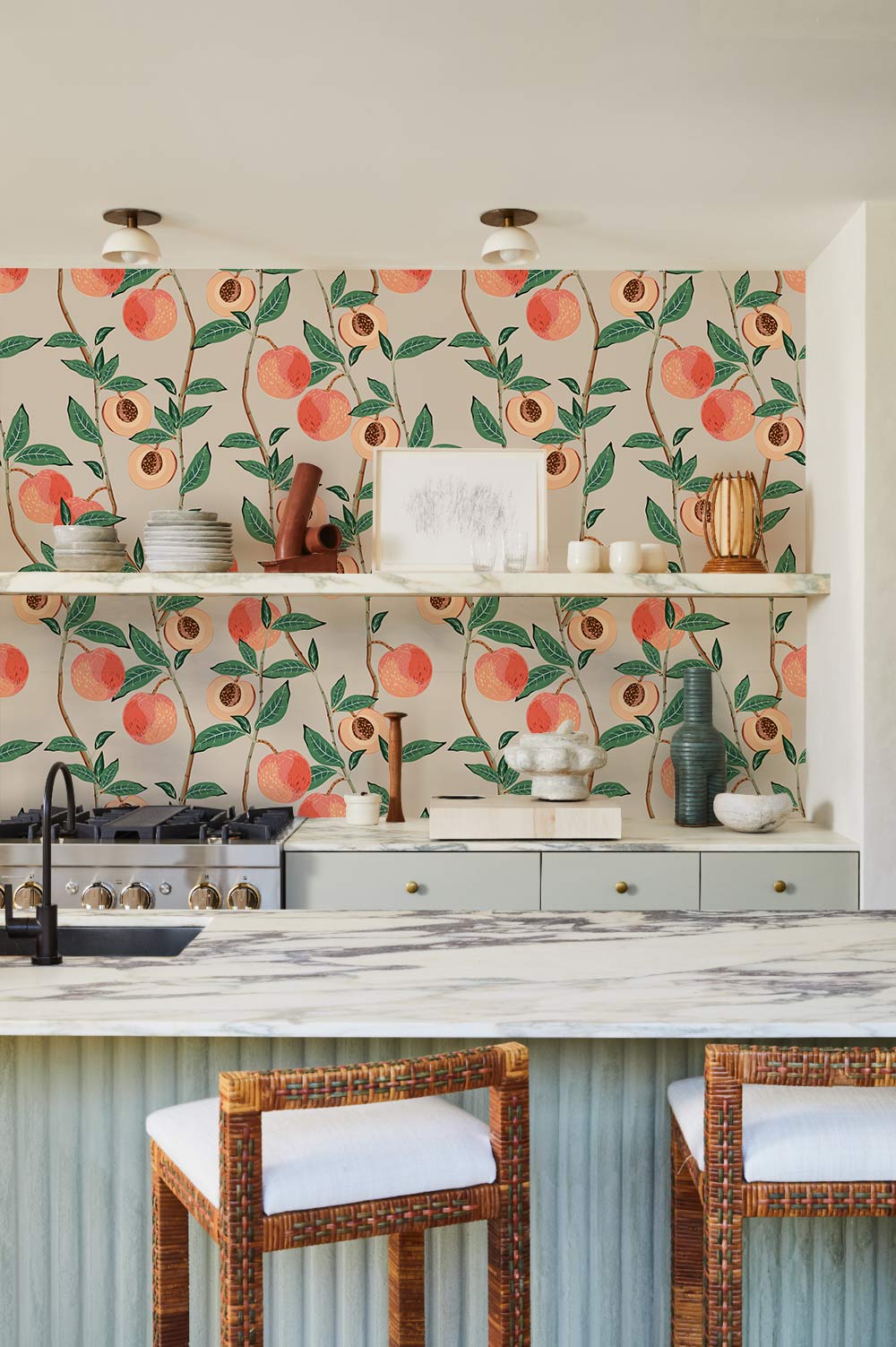 Vintage Peach Orchard Botanical Wallpaper in pastel tones with a marble countertop and wicker bar stools.
