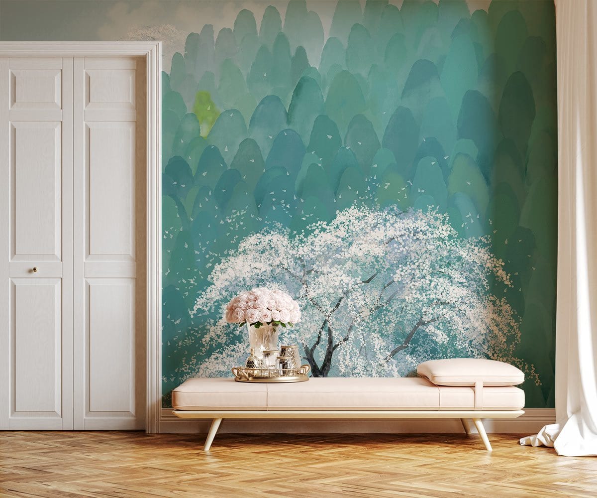 Tranquil green mountain mural with white blossom tree, pink sofa, wooden floor, elegant room setting.