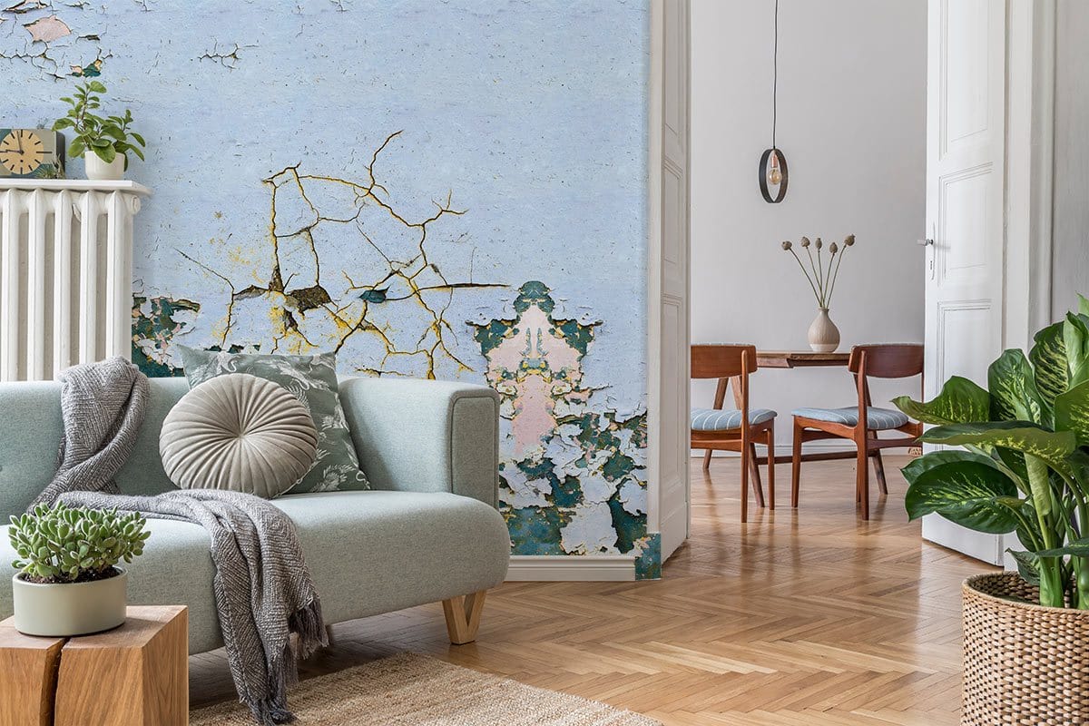 Vintage Patina Textured Wallpaper in living room, light grey sofa, wooden flooring, dining area visible.