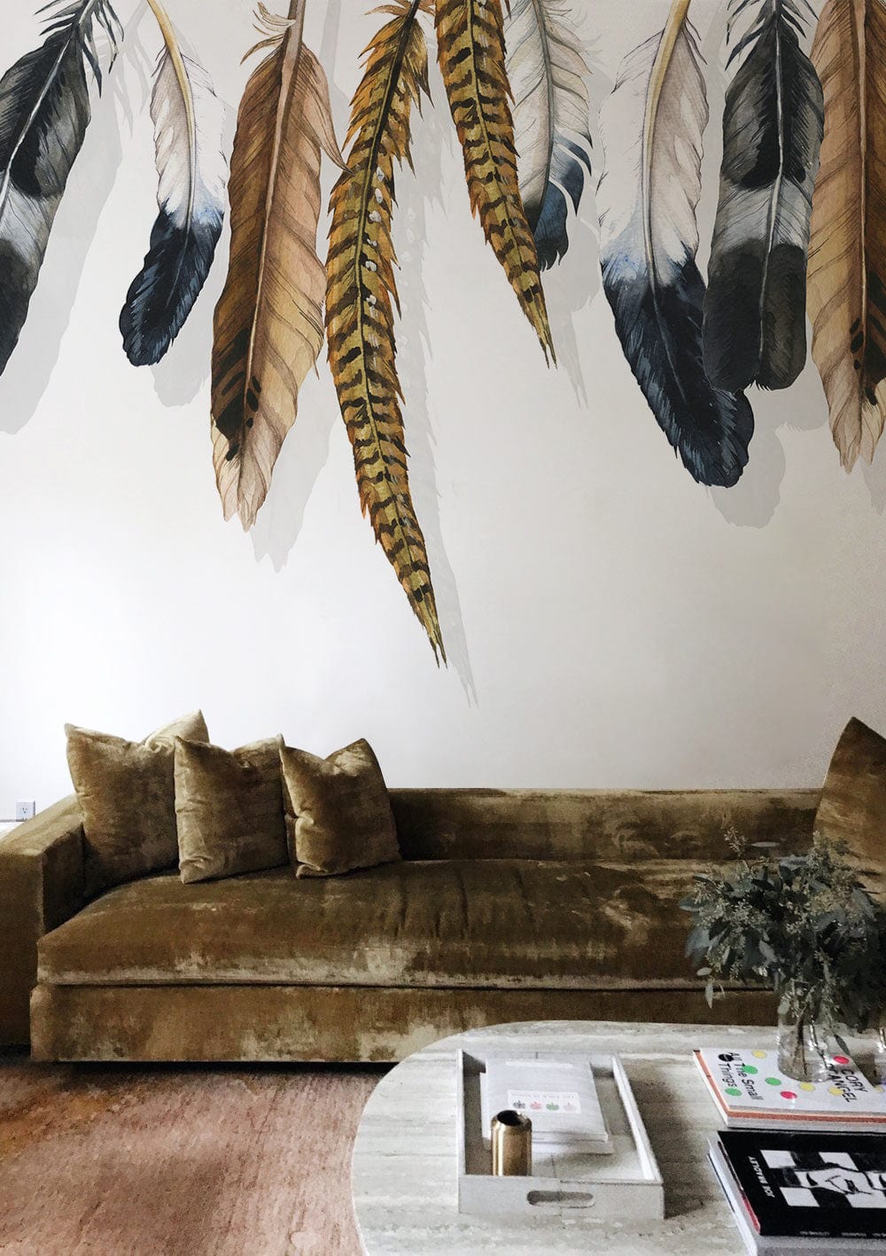 Bohemian Feathered Elegance wallpaper, velvet sofa, neutral tones, artistic mural accent, modern living room.