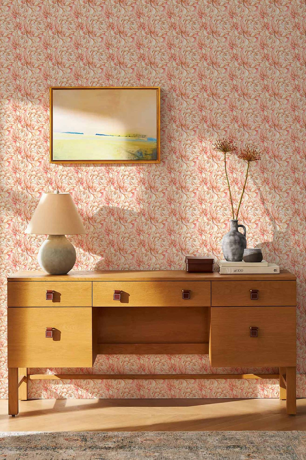 Elegant vintage floral wallpaper, soft pink and cream, wooden console, lamp, artwork, light wood flooring.