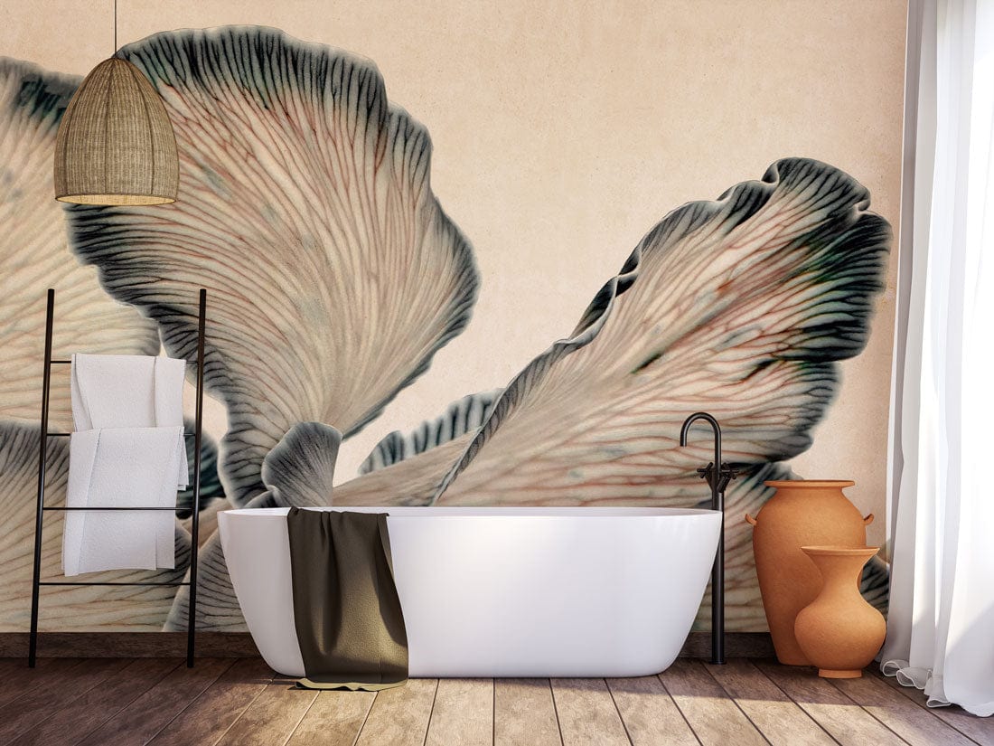 Abstract Monochrome Foliage Wallpaper in coastal bathroom with freestanding tub, wooden flooring, wicker light fixture.